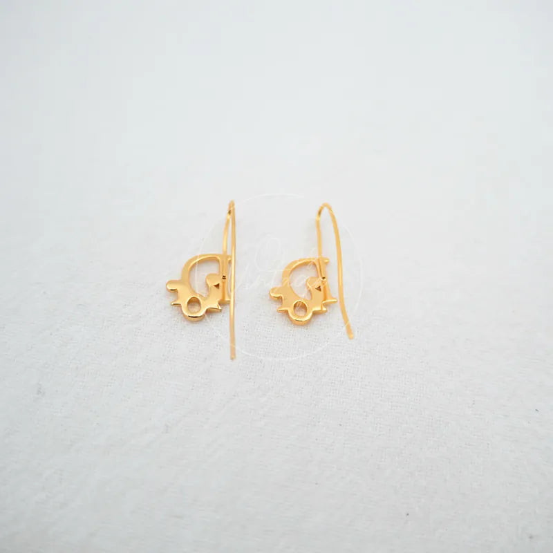 Dior Logo Drop Earrings in gold plate, featuring paired logo-shaped drop earrings and slender hook ear wires, front view