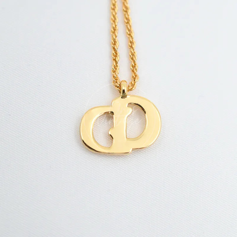 Dior CD Logo Necklace, interlocking CD logo pendant and twisted chain detail