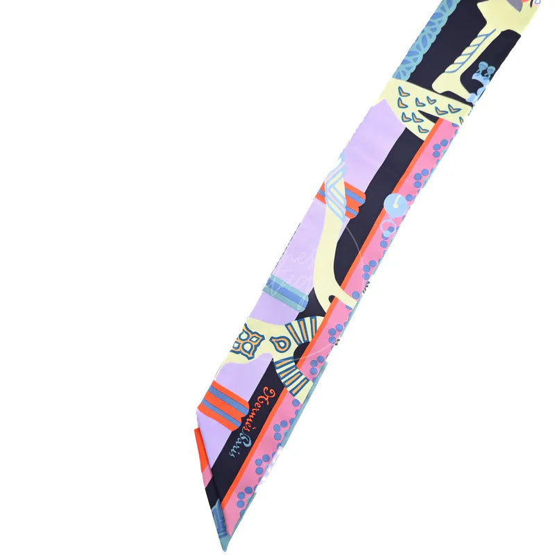 Hermès Fantaisie d'Etriers Twilly in marine, mauve and jaune soufre silk 100%, featuring multicolor equestrian-themed print, front view