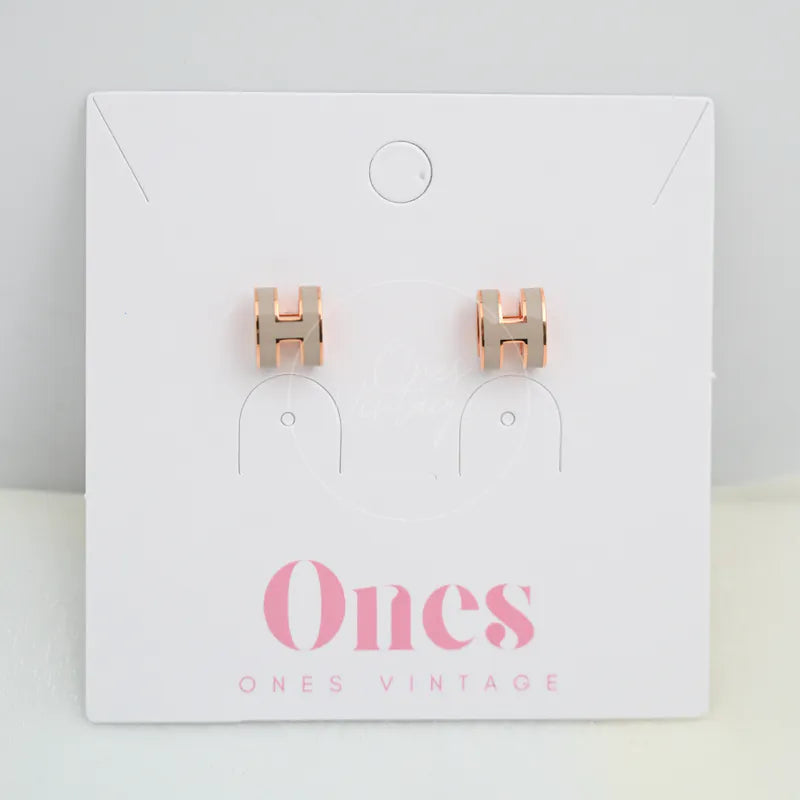 Hermès Mini Pop H Earrings Grey With Pink Gold in gold-plated alloy metal, featuring paired H-shaped stud earrings, front view