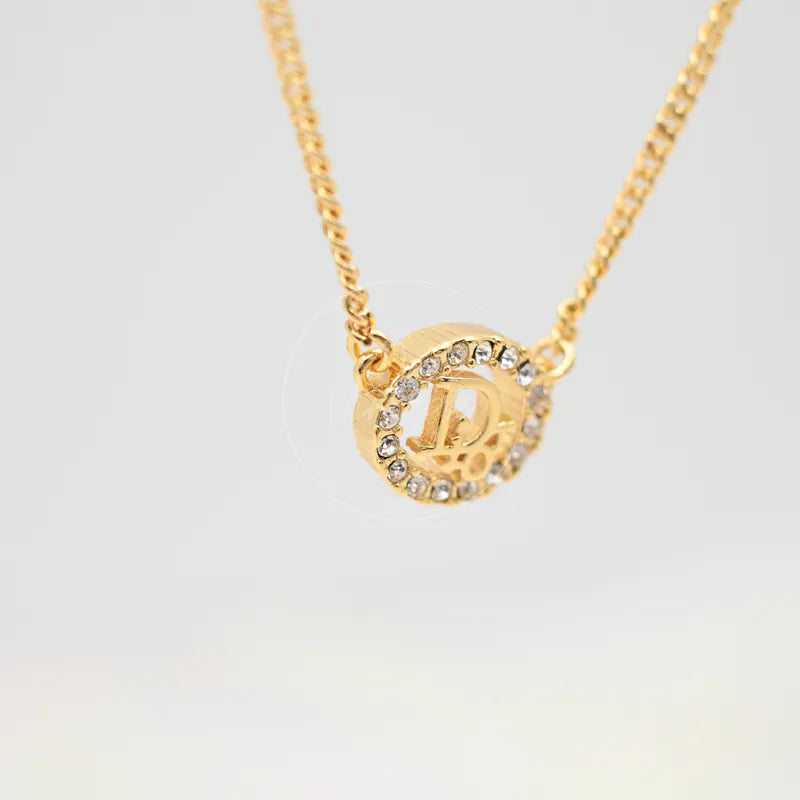 Dior CD Rhinestone Necklace, pendant with circular rhinestone border and raised central letterform detail