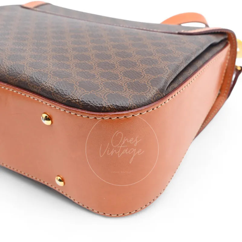 Celine Vintage Macadam Turn Lock Handbag in brown pvc, featuring protective feet and patterned canvas, base view
