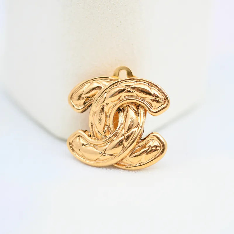 Chanel Vintage CC Earrings Clip-On in gold-plated, featuring interlocking CC motif and sculpted curved design, front view