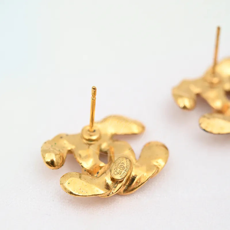 Chanel CC Logo Earrings in gold-plated, featuring sculpted interlocking shapes and twin earring posts, back view