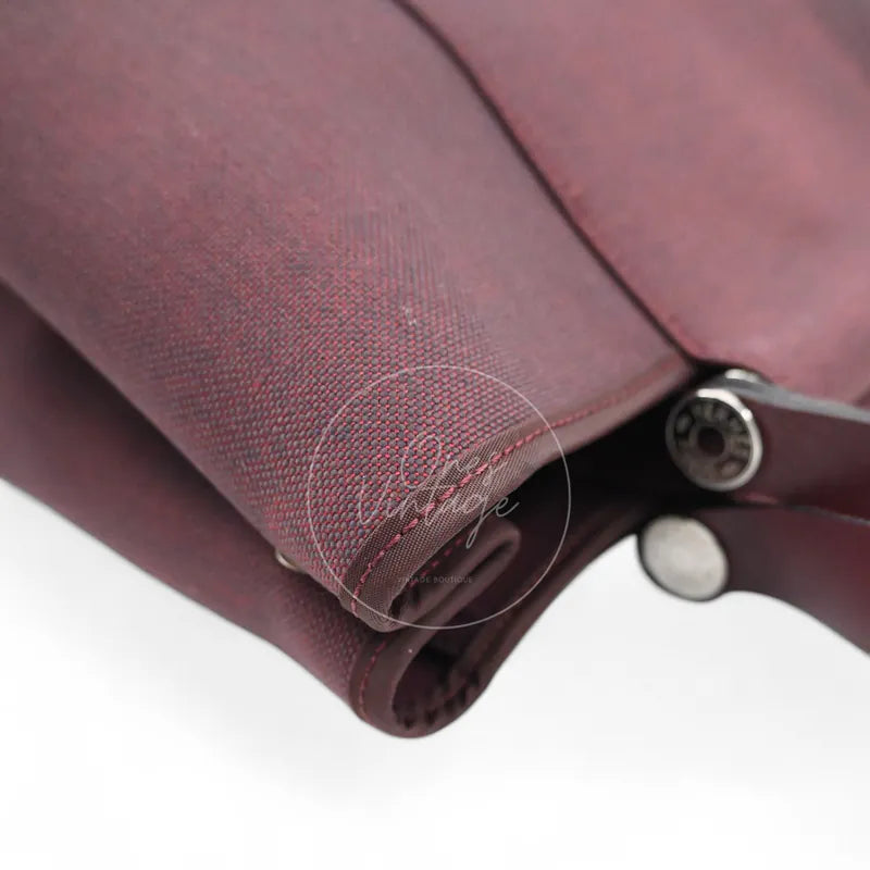 Hermès Cabag 32 tote in burgundy canvas with brown leather handles, T stamp, rear left base corner