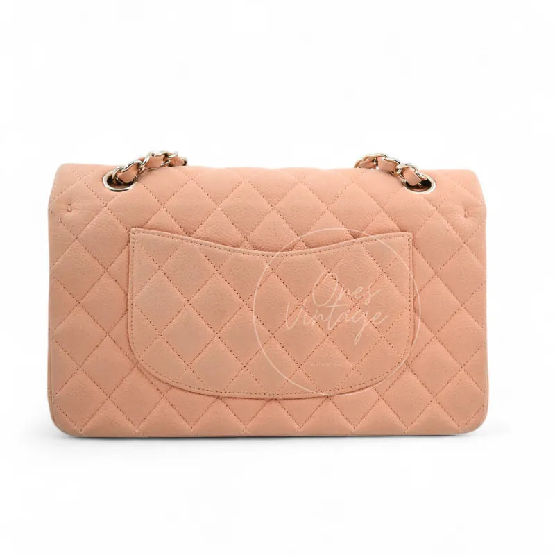 Chanel CF25 Medium Classic Flap Bag in peach caviar with gold-tone hardware, featuring rear slip pocket and chain strap, back view