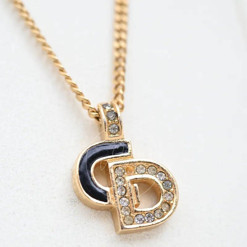 Dior Rhinestone-embellished CD logo Necklace, pendant with rhinestone-studded CD logo and black inset detail