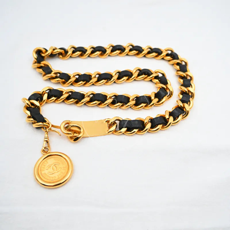 Chanel Coco Mark Chain Belt Gold Black Golden Metal in gold-plated metal, featuring interwoven black leather links, front view