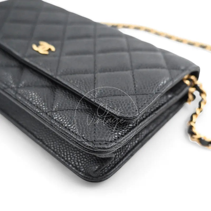 Chanel Wallet on Chain in black quilted caviar leather with gold hardware, Series 22, rear left corner