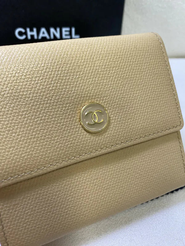 Chanel CC Logo Compact Trifold Wallet in beige calfskin, featuring flap closure and pebbled leather texture, front view
