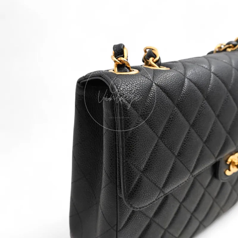 Chanel Jumbo Classic Flap Bag with gold-tone hardware, hardware with chain strap attachments and flap edge detail