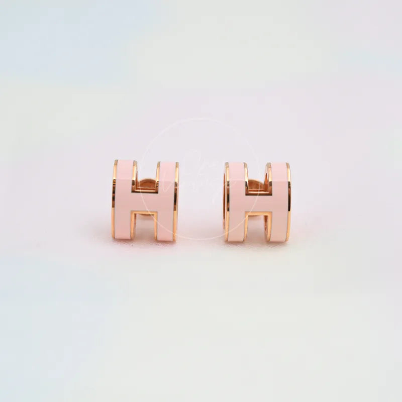 Hermès Pop H Earrings Pink with Pink Gold in gold-plated alloy metal, featuring paired H-shaped earrings and pink enamel faces, front view