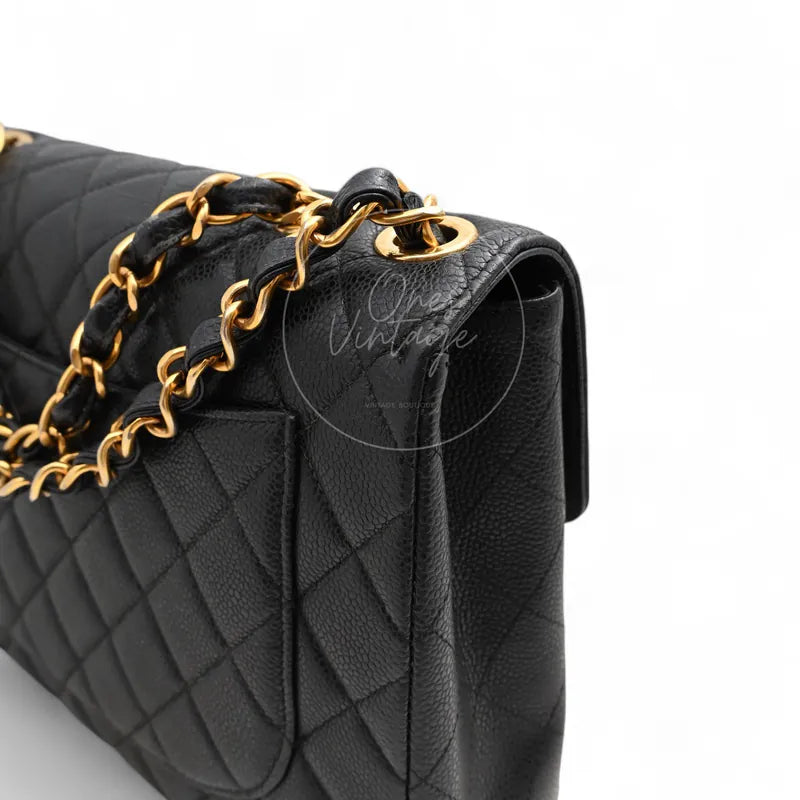 Chanel Jumbo Classic Flap Bag, interwoven chain strap and gold-tone strap attachment rings detail