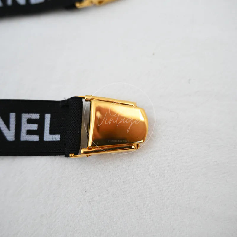 Chanel Logo-jacquard Armbands, black woven strap and gold-tone rectangular buckle detail