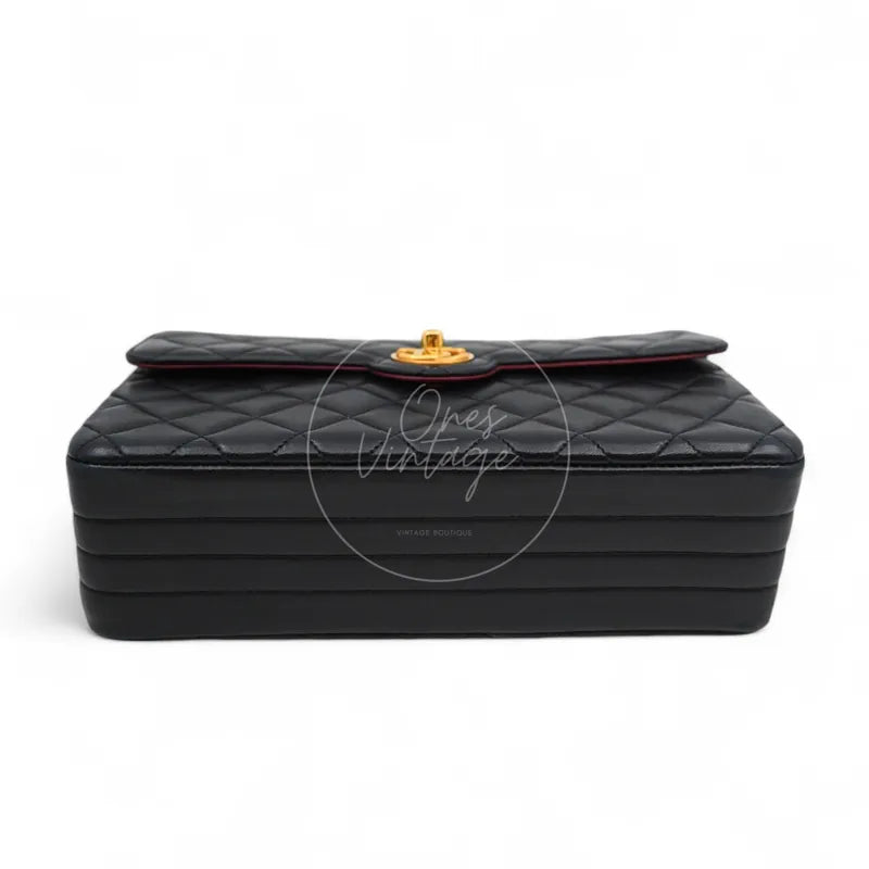 Chanel Vintage Circle CC Mark Single Flap Shoulder Bag in black lambskin, featuring gold-tone turn-lock clasp and diamond quilting, front view