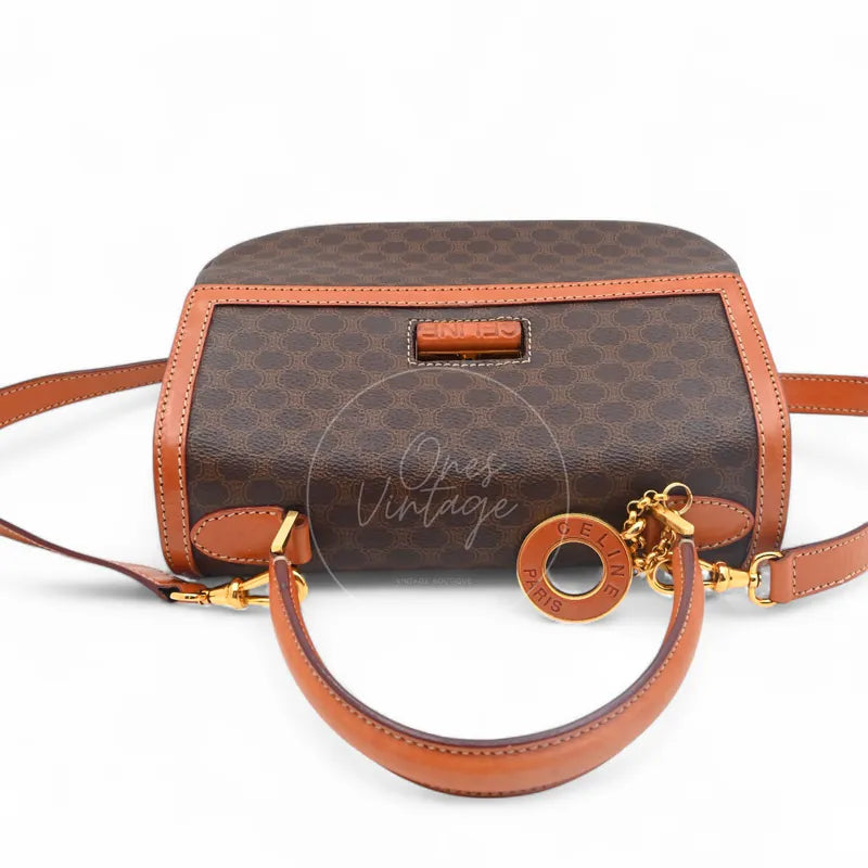Celine Vintage Macadam Turn Lock Handbag in brown pvc, featuring Turn-lock closure and Macadam monogram canvas, front view