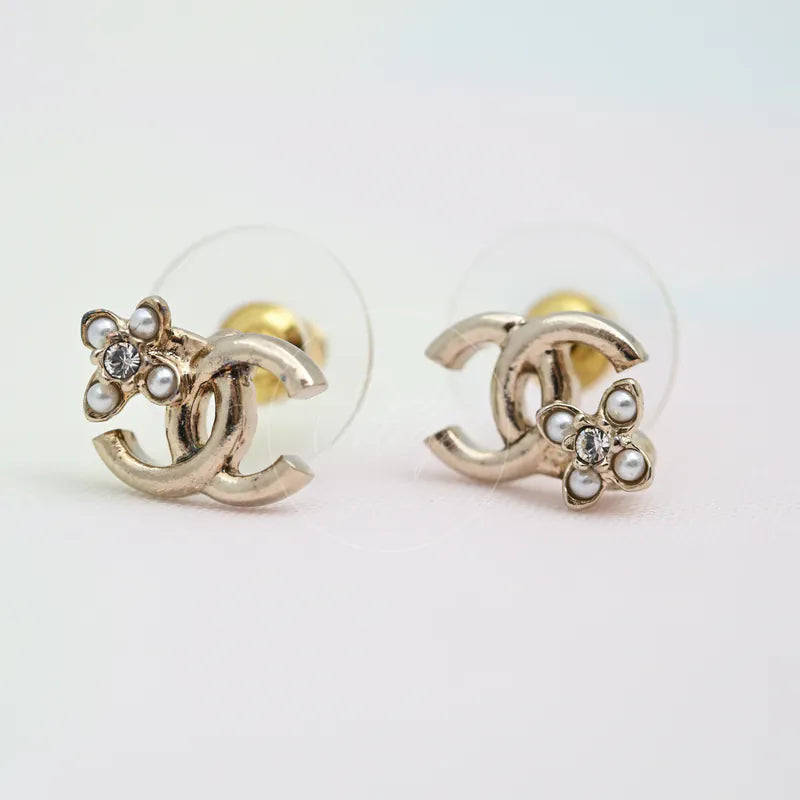 Chanel CC Lucky Clover Earrings in gold-plated alloy metal, pearl and crystal, featuring interlocking CC motifs, front view