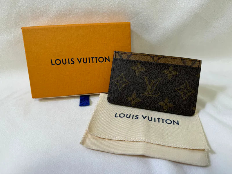 Louis Vuitton M61733 Card Holder in monogram, featuring Monogram pattern with presentation box and dust pouch, front three-quarter view