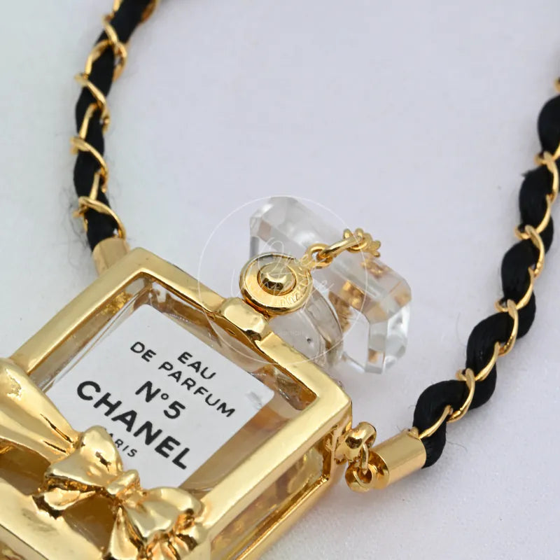 Chanel Perfume Eau De Parum No.5 24K Plated Necklace, perfume bottle-shaped pendant and Chanel No. 5 label detail