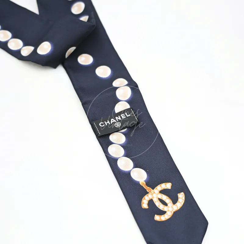 Chanel Slim Bandeau Twilly, logo with printed Chanel branding and polka-dot print detail