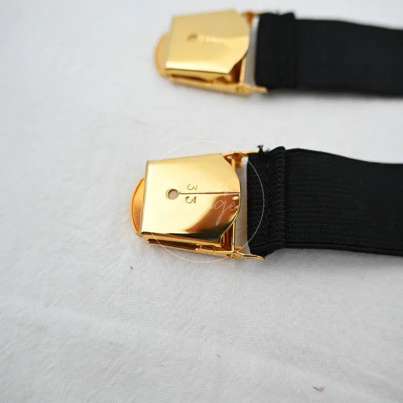 Chanel Logo-jacquard Armbands, black woven bands and gold-tone rectangular buckles detail