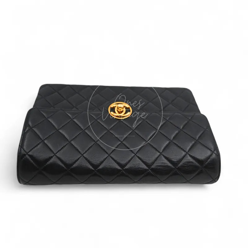 Chanel Vintage Circle CC Mark Single Flap Shoulder Bag in black lambskin, featuring central turn-lock clasp and curved flap, front view