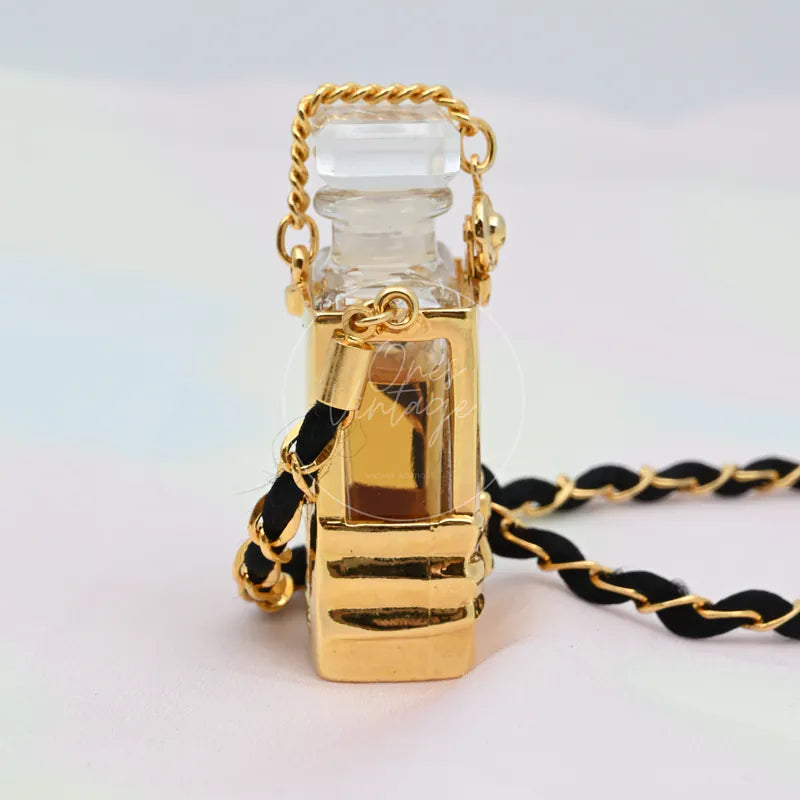 Chanel Perfume Eau De Parum No.5 24K Plated Necklace, miniature perfume bottle pendant and black-and-gold braided chain detail