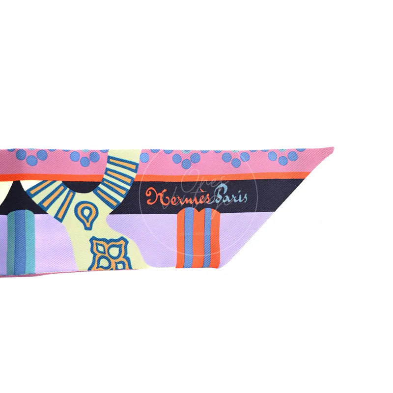 Hermès Fantaisie d'Etriers Twilly, logo with printed Hermès Paris branding and multicolour geometric motifs detail