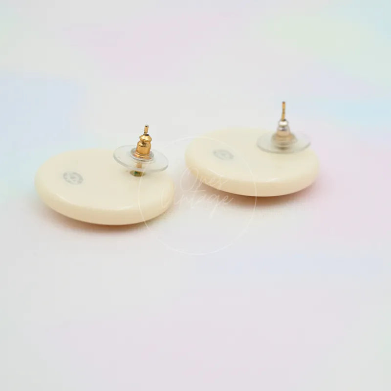 Chanel White Button With Gold CC Mark Stud Earrings in gold-plated and resin, featuring round white earring backs and metal post fittings, back view