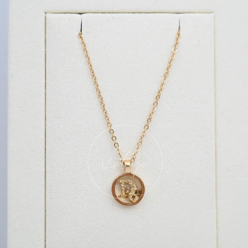 Dior Necklace Plated CD Logo in gold-plated, featuring round medallion pendant and linked chain, front view