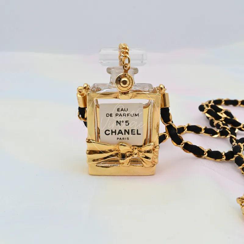 Chanel Perfume Eau De Parum No.5 24K Plated Necklace, pendant with perfume bottle silhouette and bow accent detail