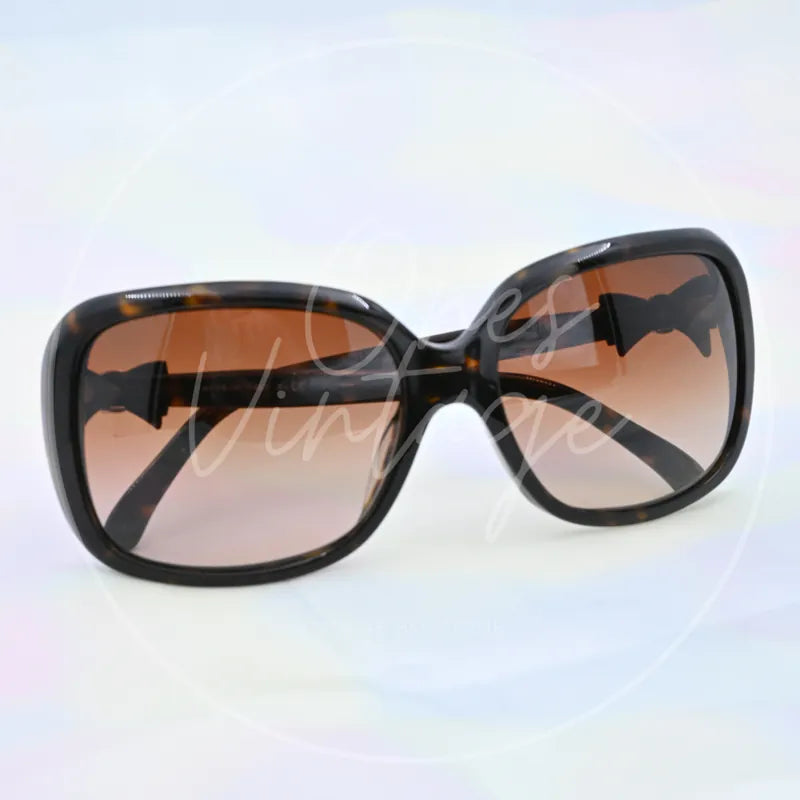 Chanel Sunglasses in black tortoiseshell, featuring oversized rectangular frame and gradient tinted lenses, front view