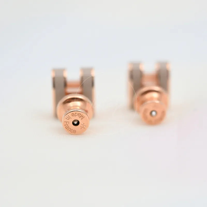 Hermès Mini Pop H Earrings Grey With Pink Gold in gold-plated alloy metal, featuring circular earring backs and twin posts, back view
