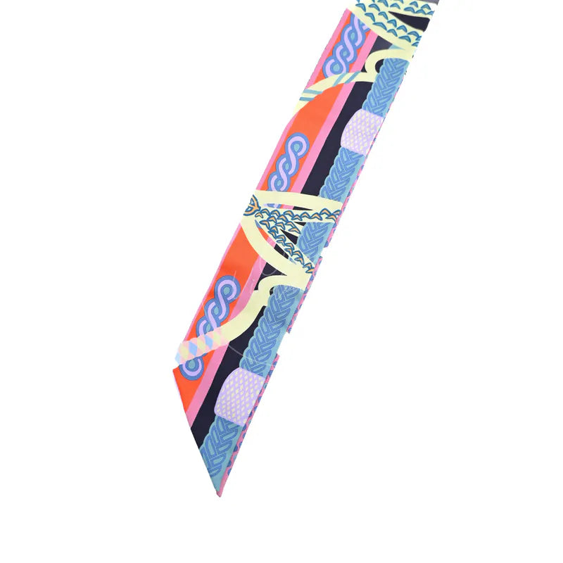 Hermès Fantaisie d'Etriers Twilly in marine, mauve and jaune soufre silk 100%, featuring narrow printed scarf and pointed ends, front view