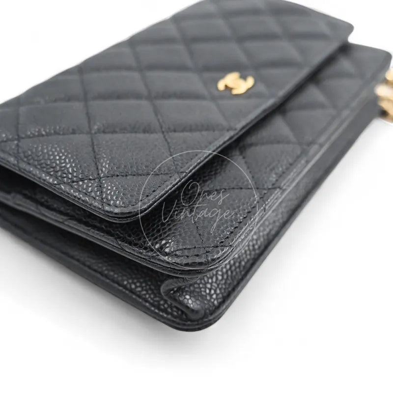 Chanel Wallet on Chain in black quilted caviar leather with gold hardware, Series 22, rear right corner