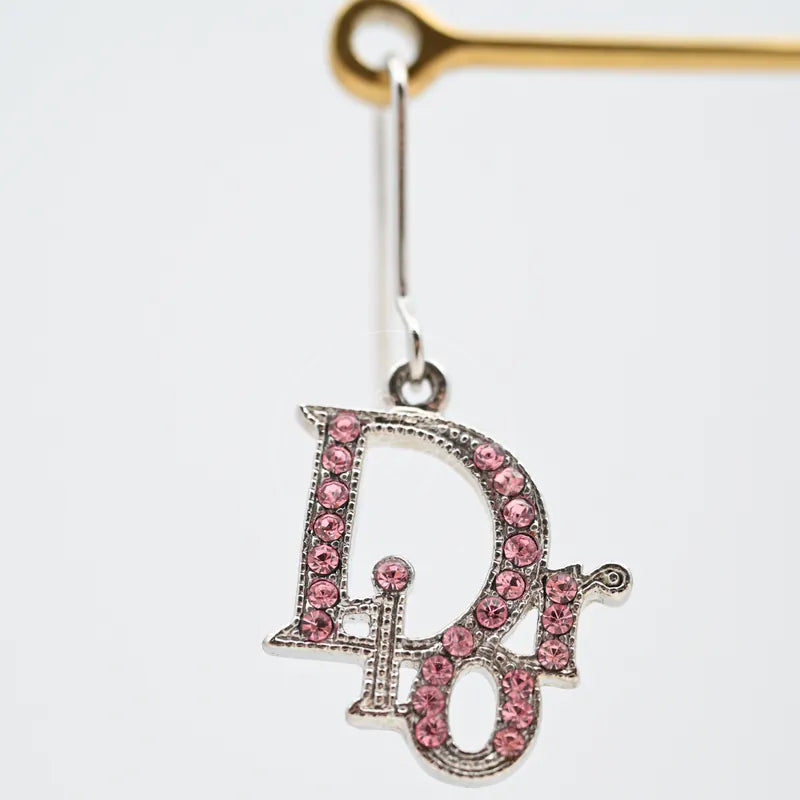 Dior Silver Pink Oblique Pink Rhinestones Earrings in alloy metal, featuring pink rhinestone pavé and drop earring silhouette, front view