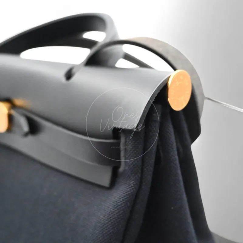 Hermès Herbag Zip 31 Canvas toile canvas and swift, black top handle and gold-tone round hardware detail