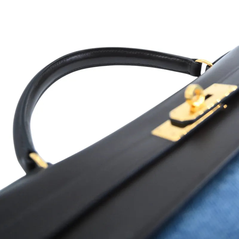Hermès Kelly 35 x Stamp brown and, gold-tone clasp hardware and rounded leather top handle detail