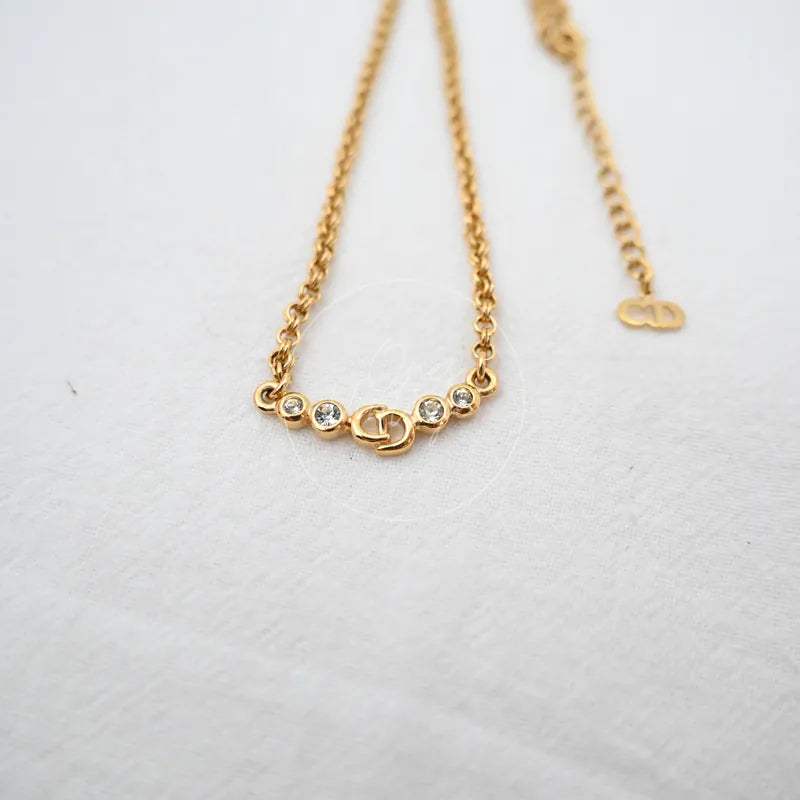 Dior CD Logo Necklace in alloy metal and rhinestone, featuring CD logo pendant and rhinestone-set circular elements, front view