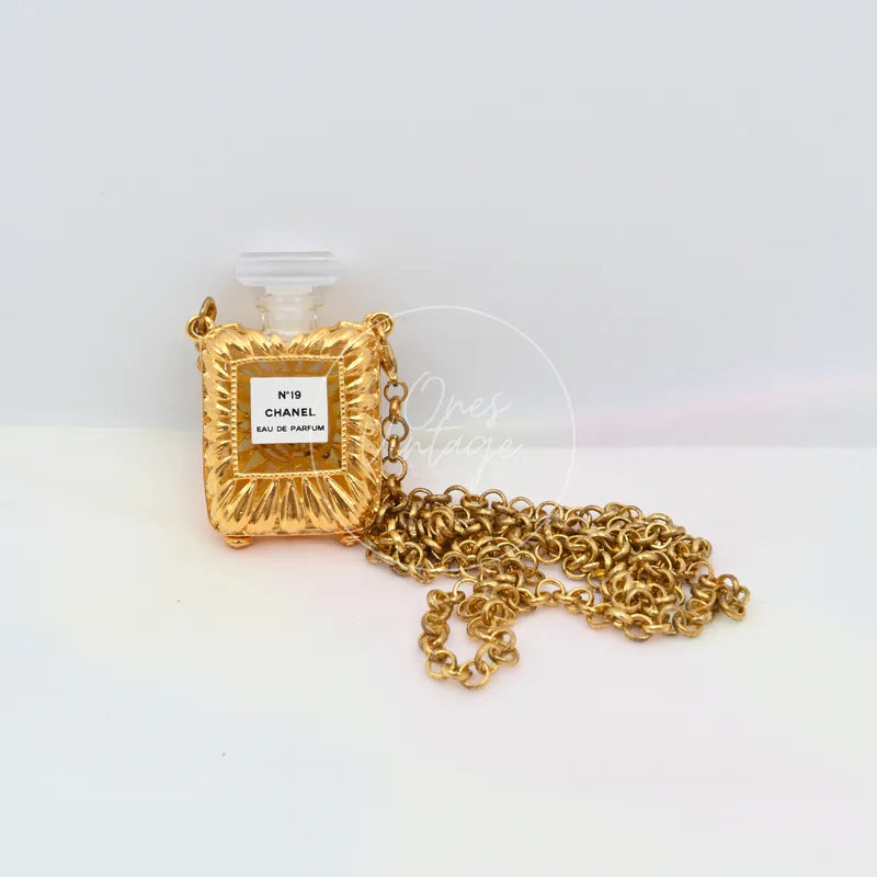 Chanel Vintage N19 Perfume Bottle Necklace in 18K gold-plated metal and plastic, featuring square perfume-bottle pendant, front view
