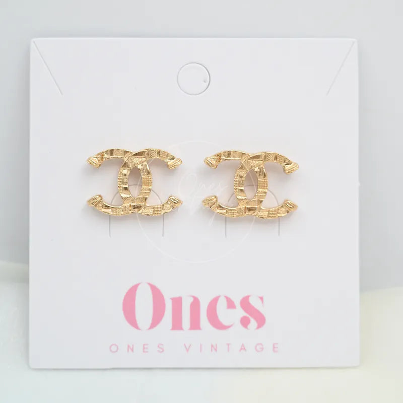Chanel CC Mark in Checked Pattern Stud Earrings in gold-plated alloy metal, featuring paired CC logo stud earrings, front view