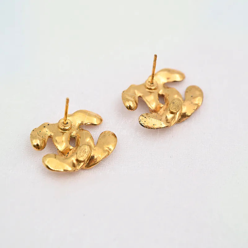 Chanel CC Logo Earrings in gold-plated, featuring paired earring posts and rear CC logo relief, back view