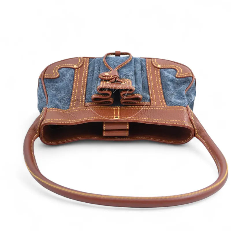 Celine Blason Triomphe Logo Shoulder Bag in brown and blue, featuring central leather closure with long shoulder strap, front three-quarter view