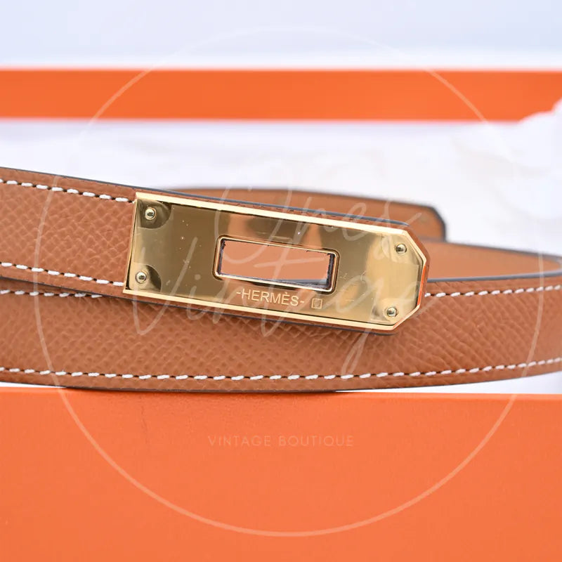 Hermès Kelly Belt with gold-tone hardware, rectangular polished metal buckle and corner fasteners detail