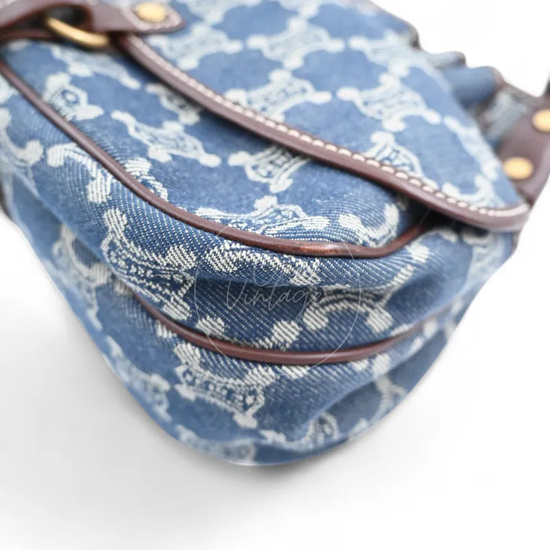 Close-up of bottom leather piping and denim canvas corner of a vintage Céline bag