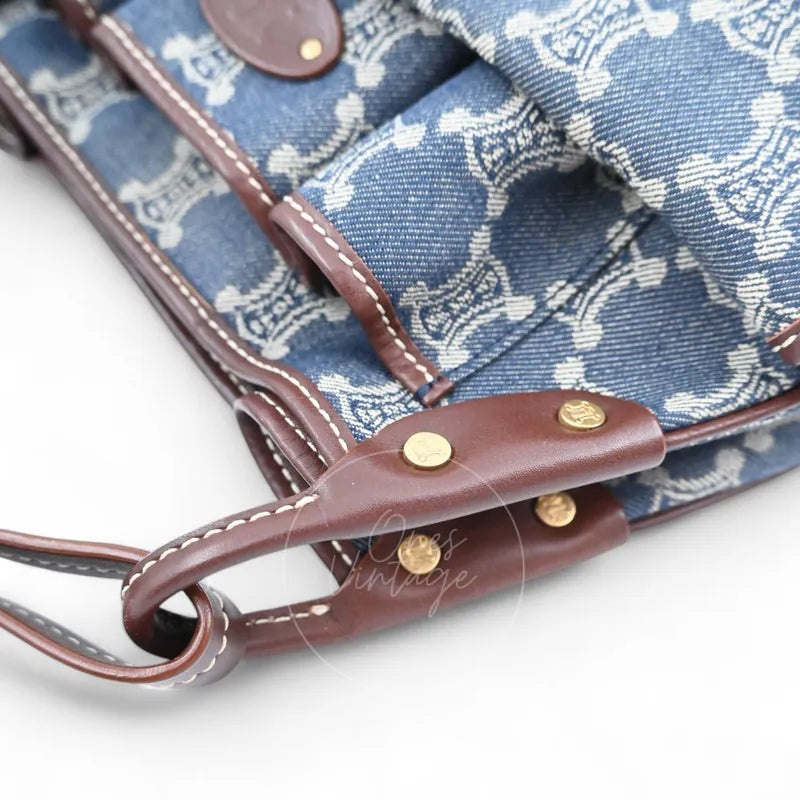 Close-up of vintage Céline denim bag showing side leather trim and contrast stitching