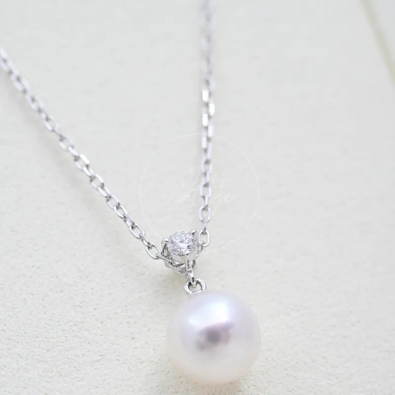 Tasaki Akoya Pendant Necklace, round pearl drop and diamond-set pendant bail detail