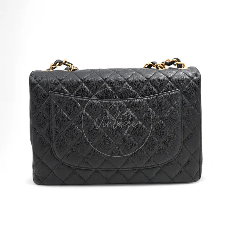 Chanel Jumbo Classic Flap Bag in black caviar with gold-tone hardware, featuring front flap pocket and chain strap, front view