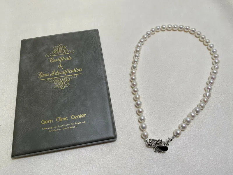 Akoya Pearl 3mm Necklace in akoya pearl, featuring ornamental clasp and single strand of round pearls, front view