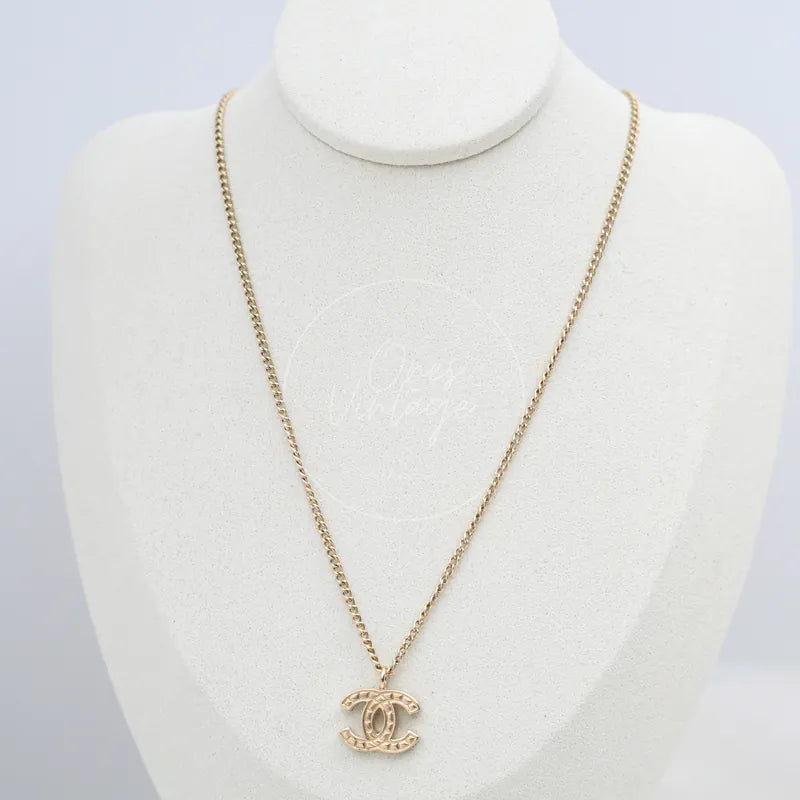Chanel CC Clip-on Necklace in gold-plated, featuring interlocking CC pendant and fine link chain, front view